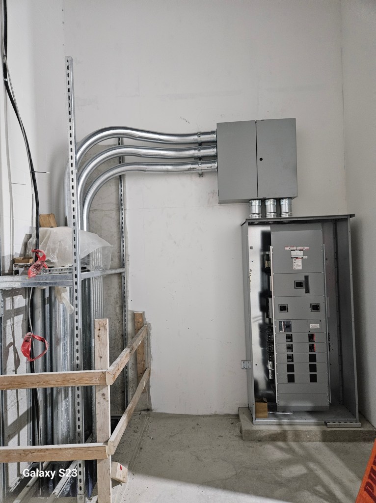 Panel with conduit feeds