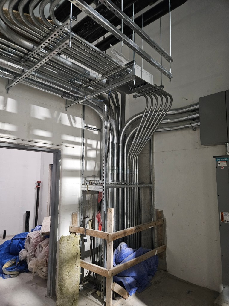 Conduit installed on ceiling racks